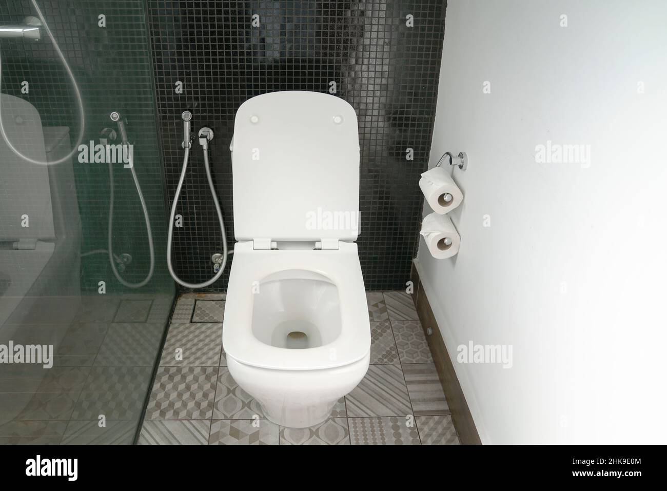 Toilet bowl in hotel bathroom, modern interior. Stock Photo