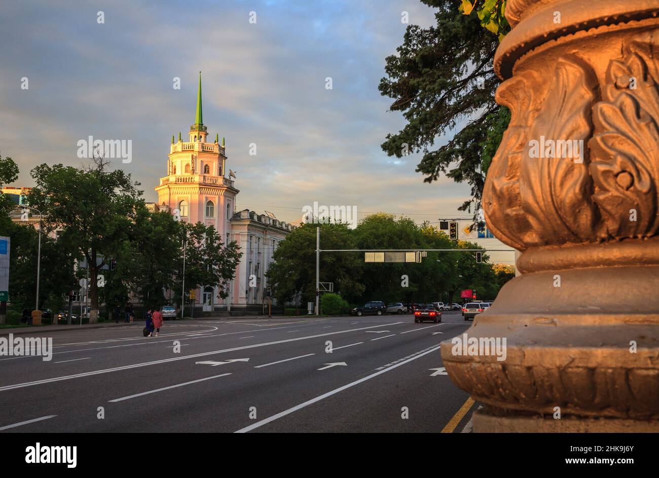 Old square in Almaty at evening/Almaty, Kazakhstan - May 6, 2017; People and cars are moving along the street Stock Photo
