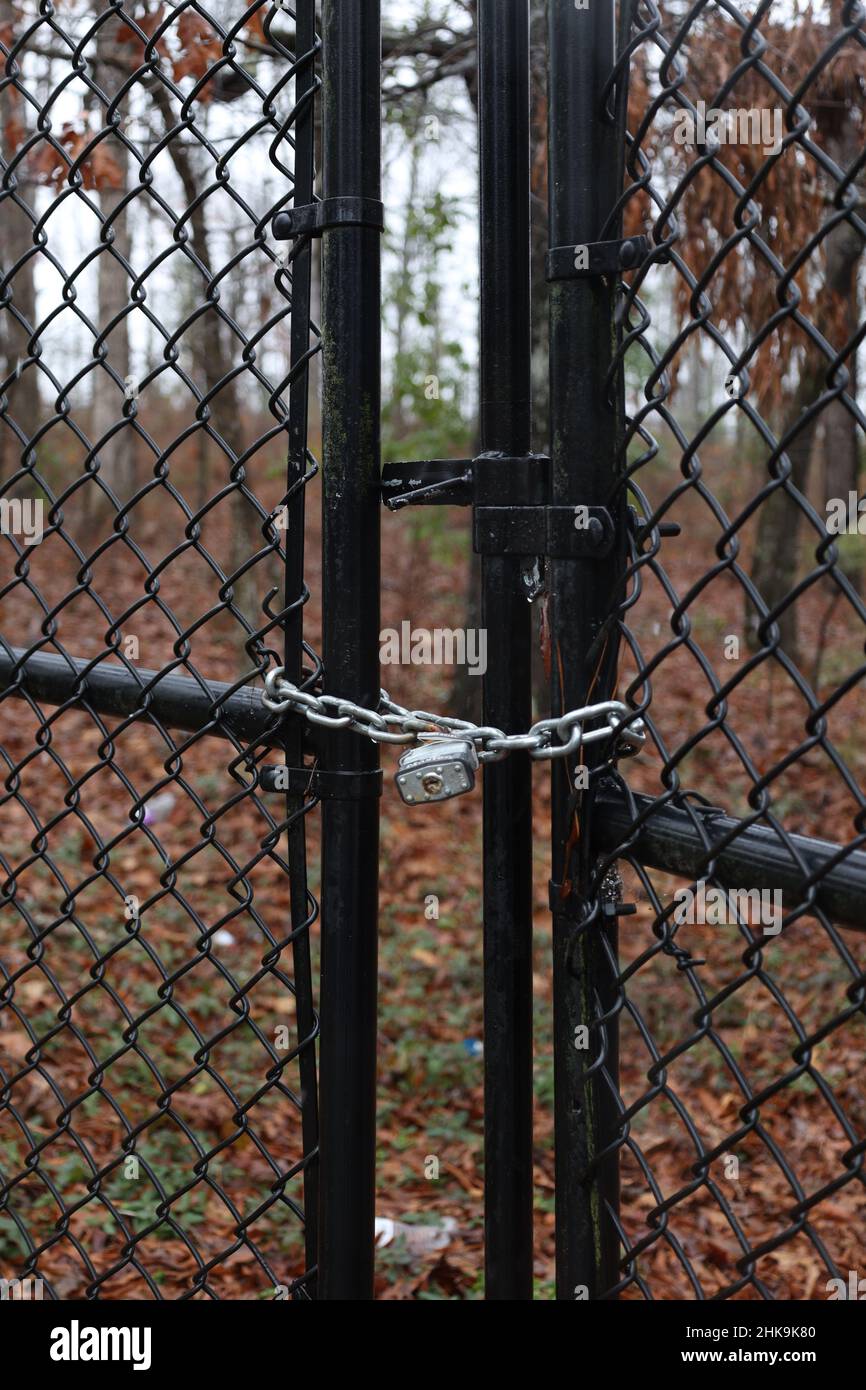 Chainlink fence door with a padlock Stock Photo Alamy