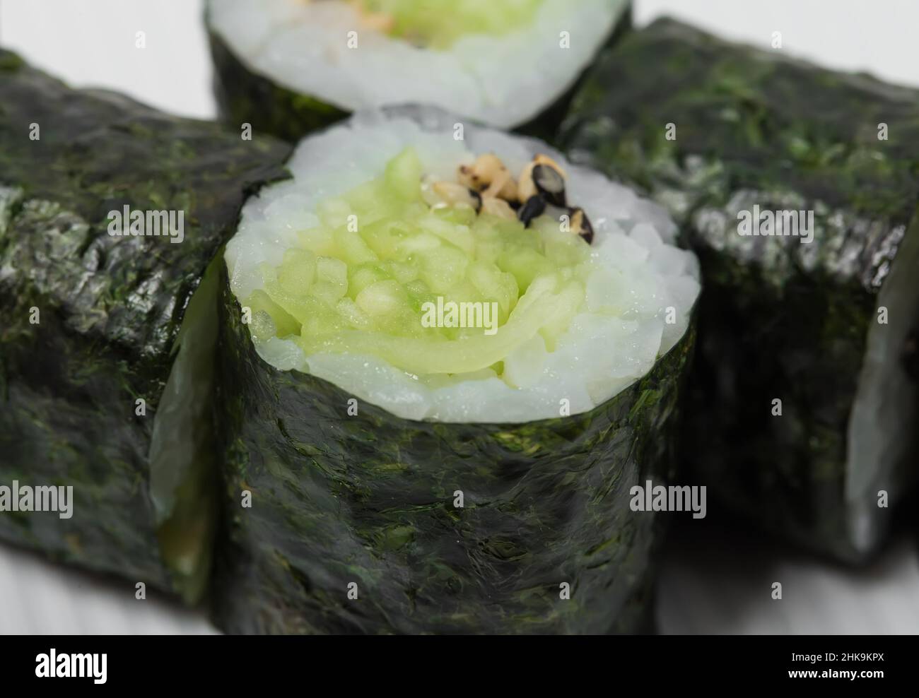 Traditional japanese vegetarian sushi roll with cucumber and sesame. As