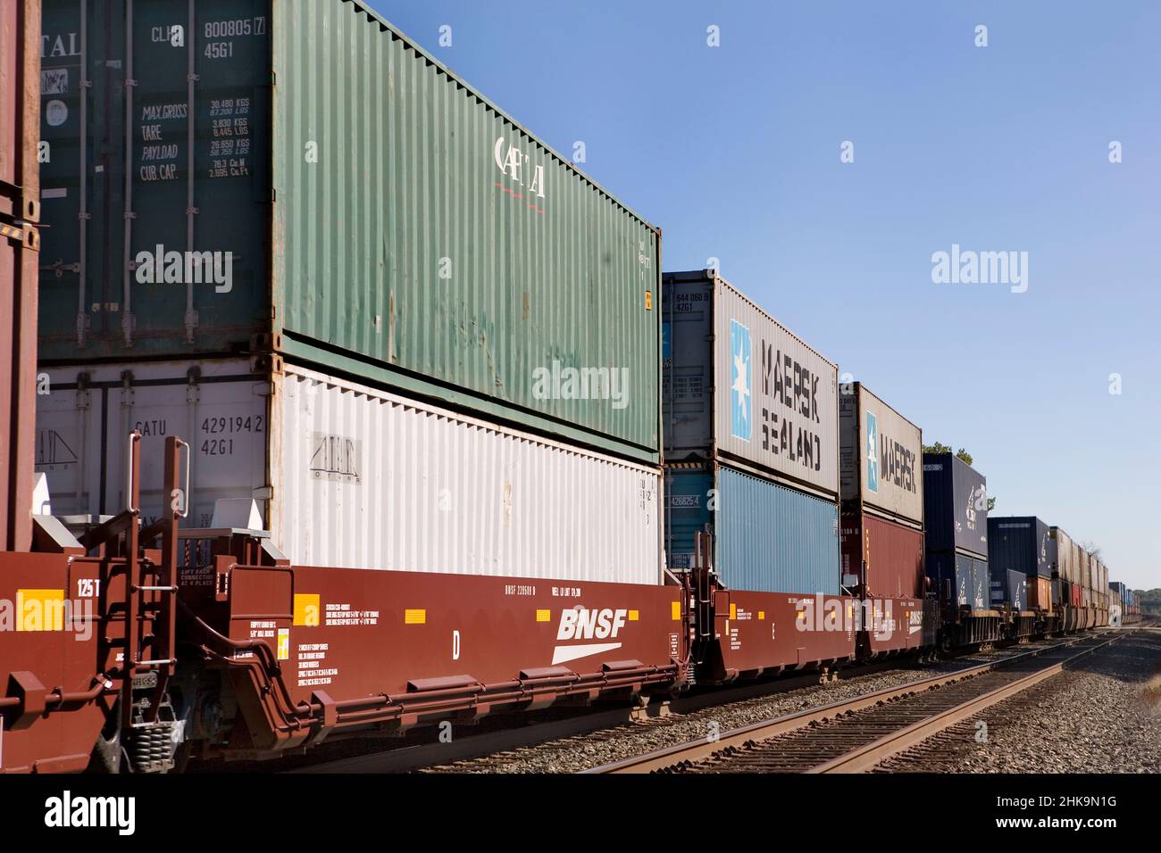 Containers of cargo on freight train Stock Photo - Alamy