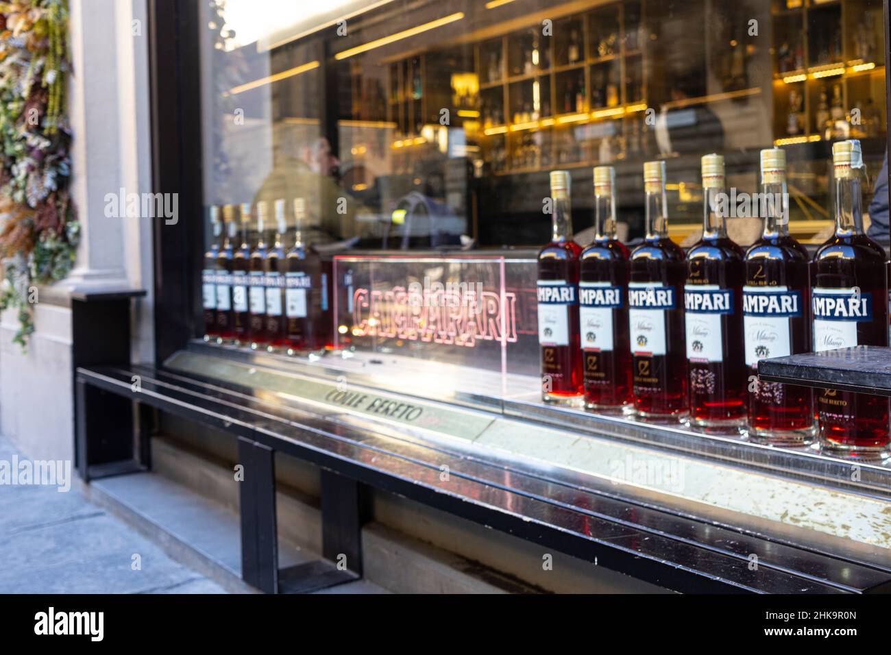 Florence, Italy. January 2022.  a row of bottles of Campari brand bitters on the window of a bar in the city center Stock Photo