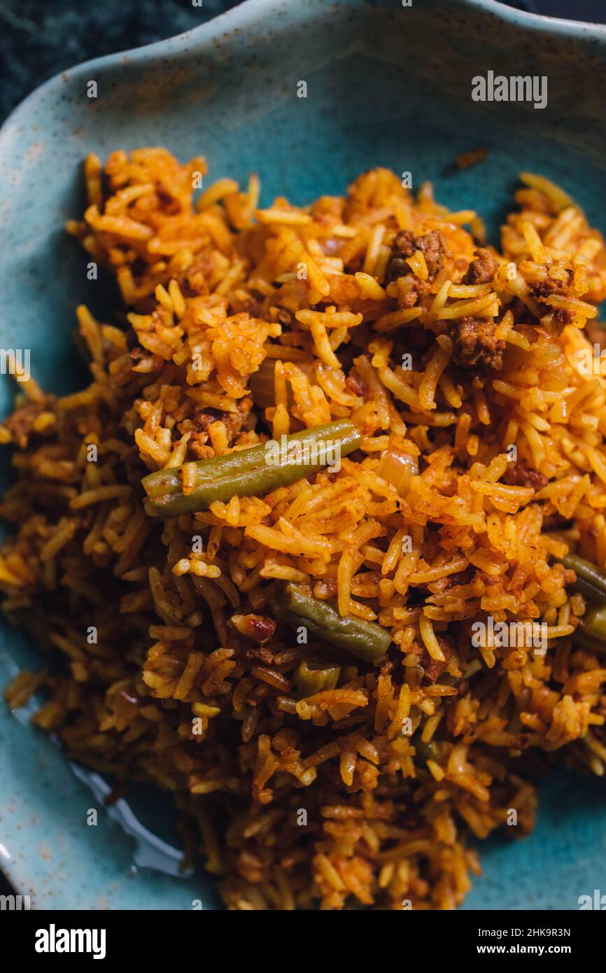 Lubia polo Persian rice dish with ground beef, green beans, turmeric Stock Photo