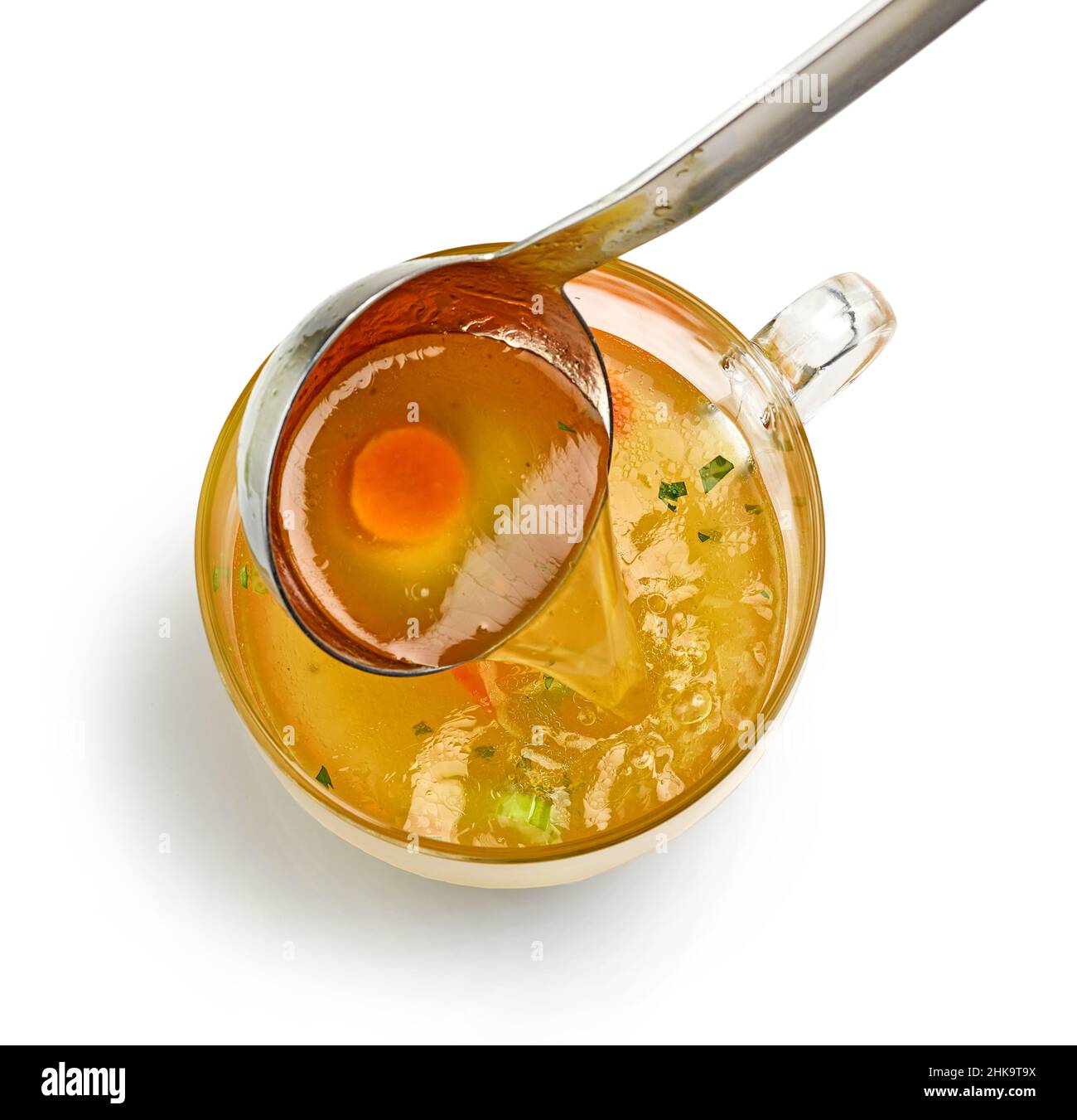 cup of fresh chicken bouillon isolated on white background, top view