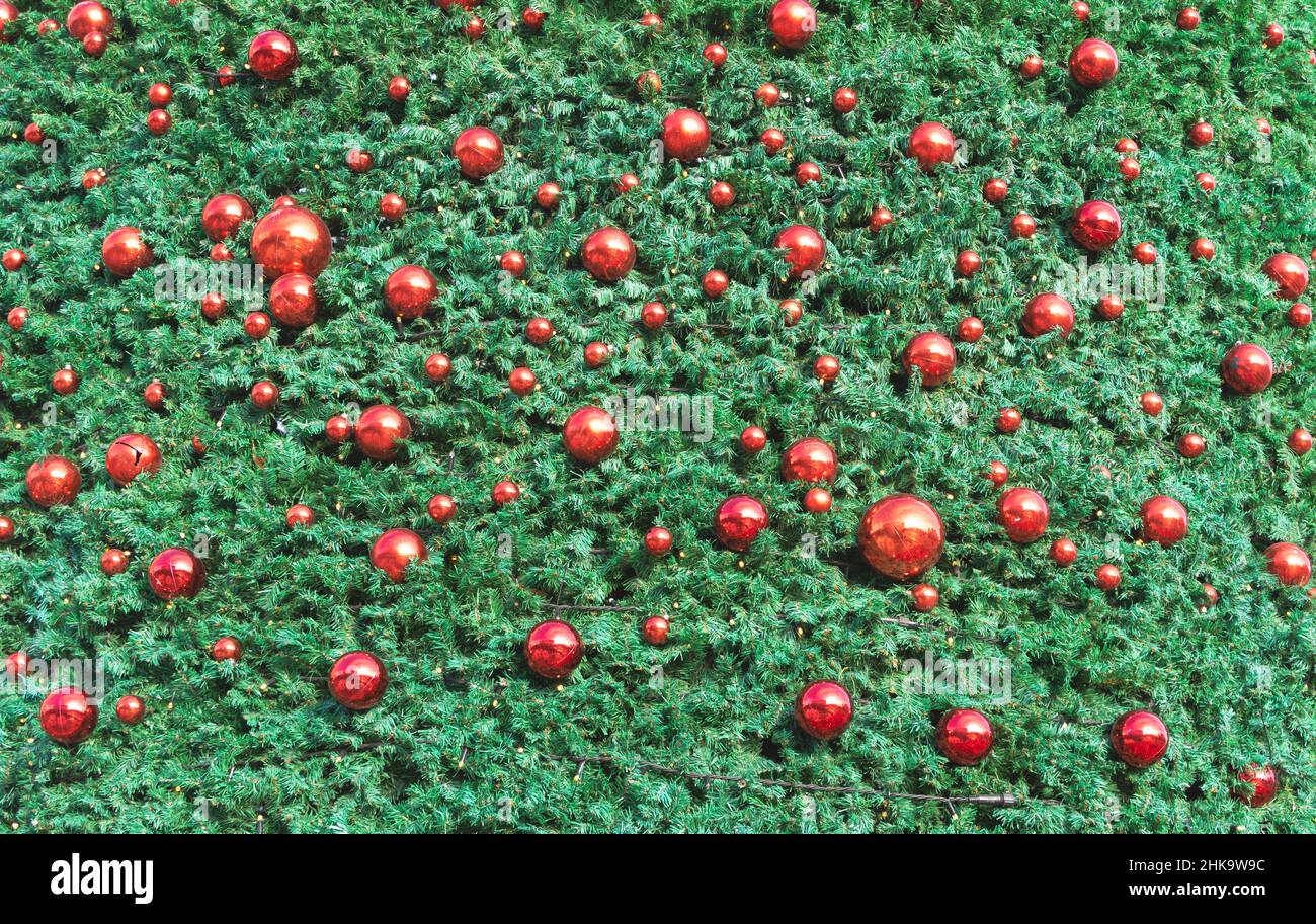 Close up texture af a christmas tree decorated with red balls. Stock Photo