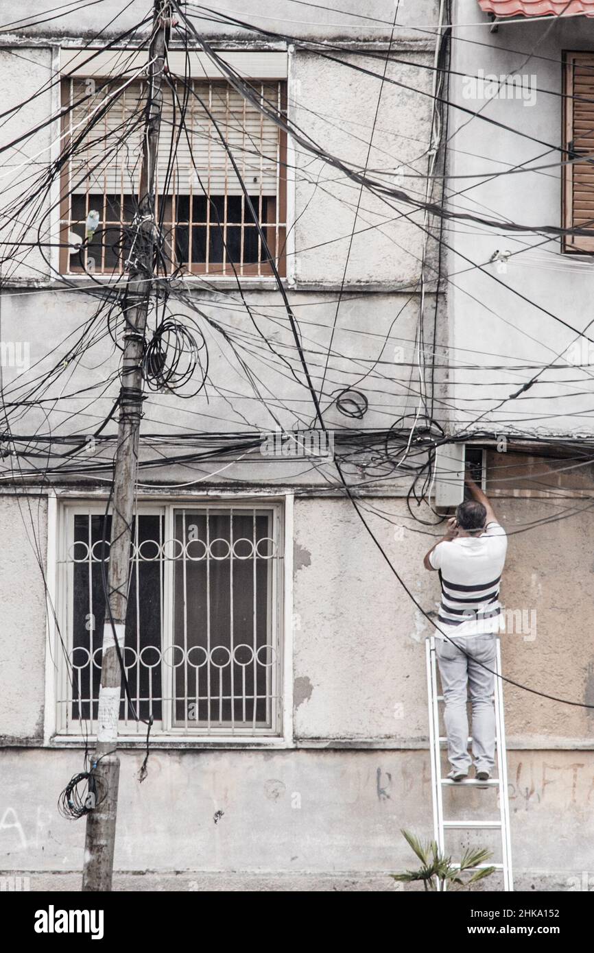 repairer of telephone lines working on street Stock Photo Alamy