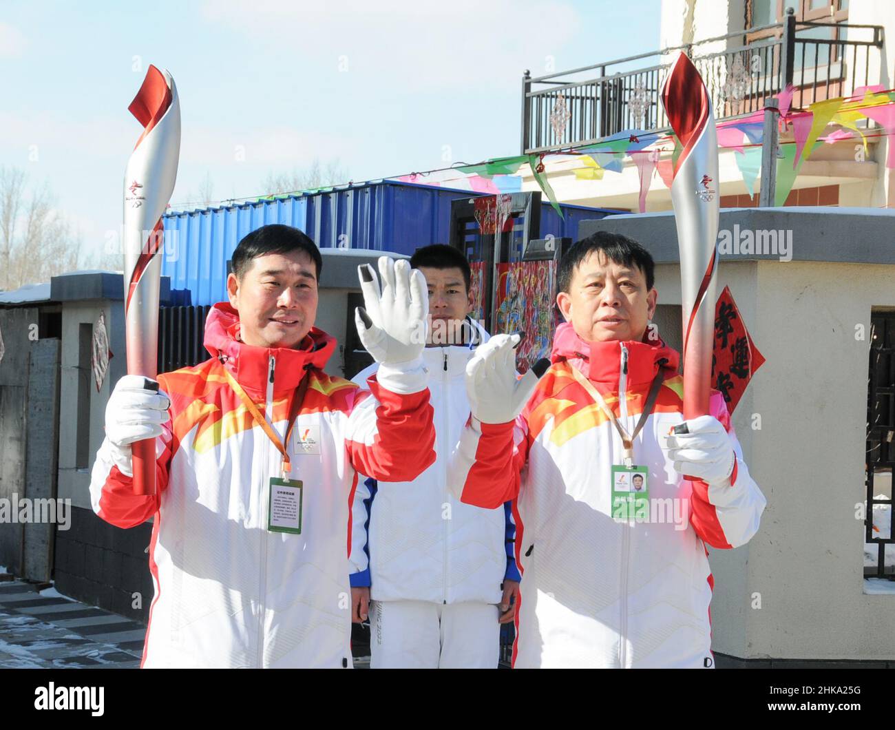 Zhangjiakou, China's Hebei Province. 3rd Feb, 2022. Torch bearers Ding Hui (L) and Cui Chaobo (R) attend the Beijing 2022 Olympic Torch Relay at Desheng Village in Zhangbei County of Zhangjiakou, north China's Hebei Province, Feb. 3, 2022. Credit: Zhao Hongyu/Xinhua/Alamy Live News Stock Photo