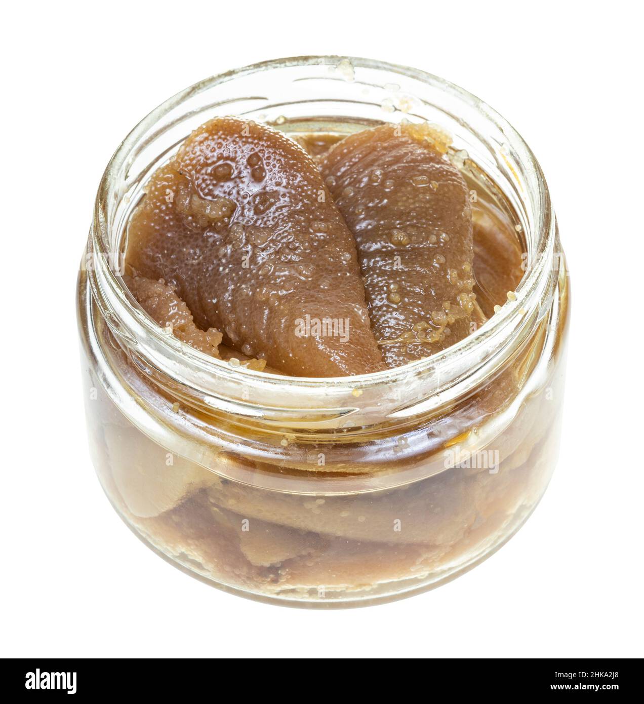 salted herring caviar in yastiki in oil in glass jar isolated on white
