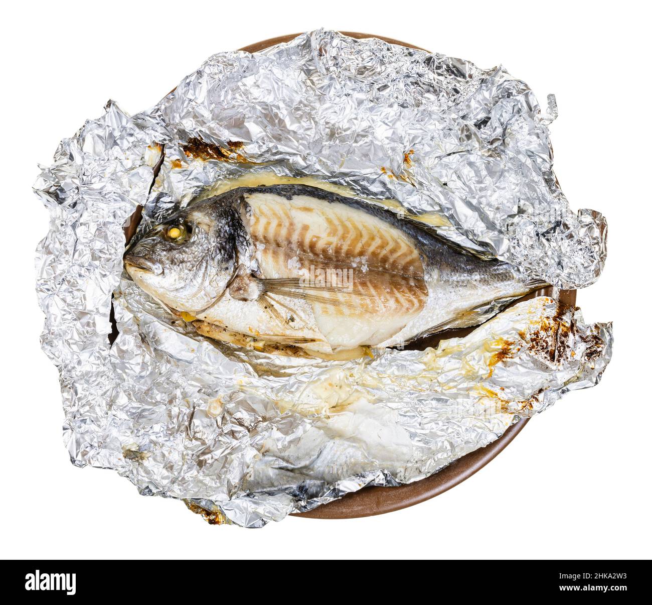 unwrapped whole gilt-head sea bream fish baked in foil on plate isolated on white background Stock Photo