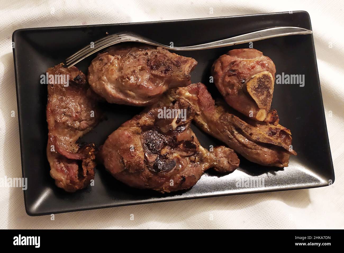 Second dish, roasted lamb scottadito style Stock Photo