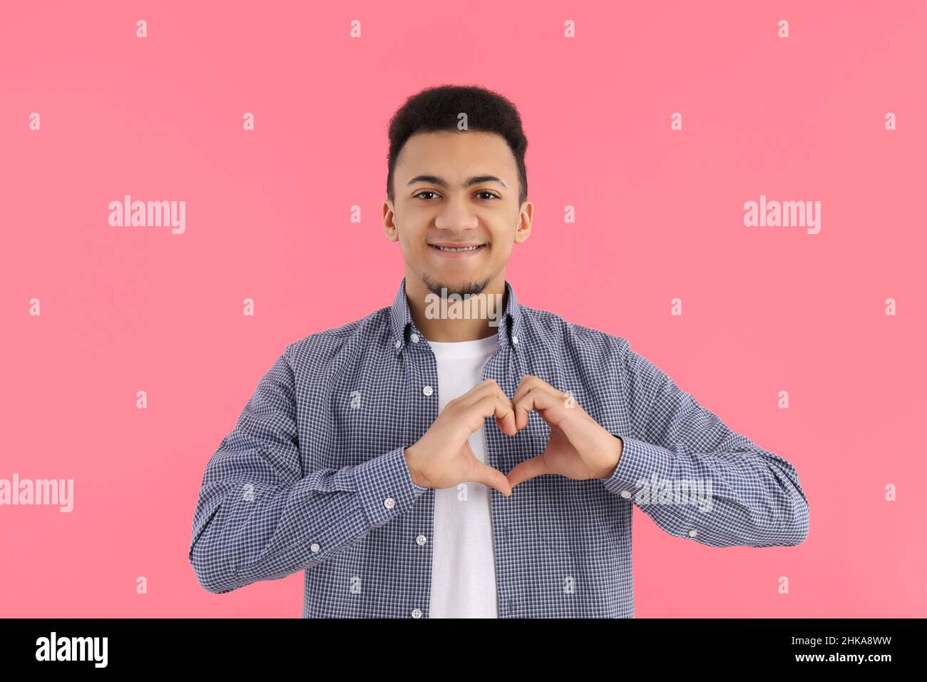 Young male in pink shirt hi-res stock photography and images - Alamy