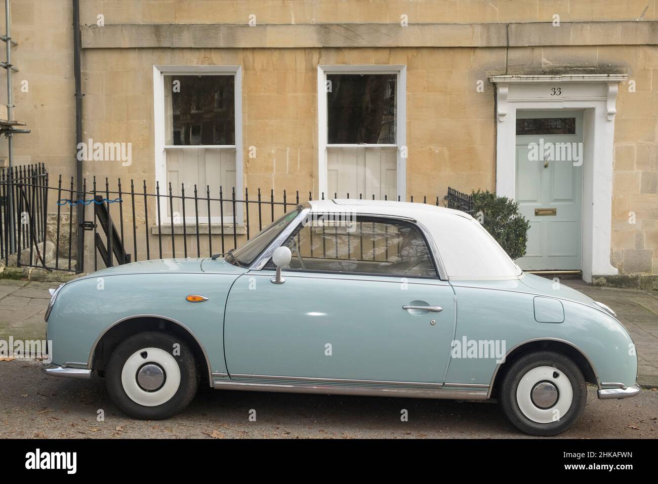 A blue (or pale aqua) 2004 model Nissan Figaro, two door convertible. Stock Photo
