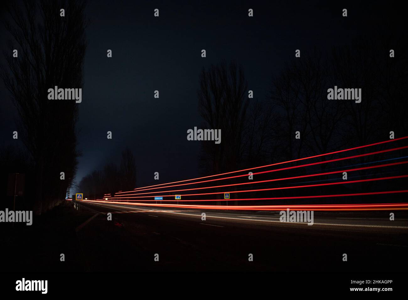 Red and white lights from passing cars. Night highway Stock Photo Alamy