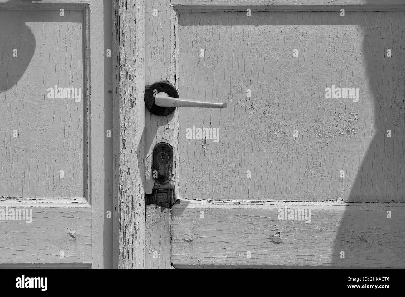 Close up view of a vintage door handle on a white door in Santorini Greece Stock Photo