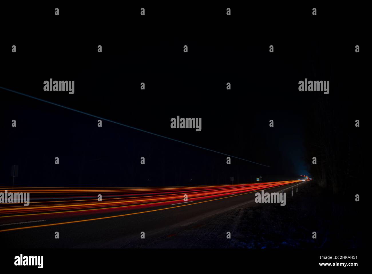 Red and white lights from passing cars. Night highway Stock Photo Alamy