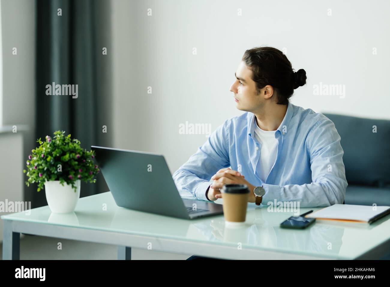 Young man working on laptop Stock Photo