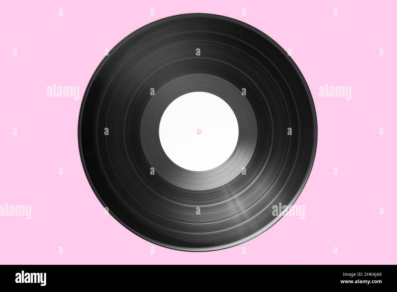 Vinyl record with bank label isolated on pink background. Mock up Stock Photo