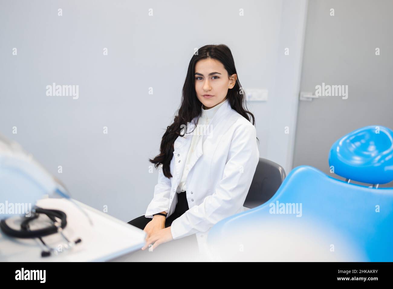 Portrait of young female dentist in office Stock Photo