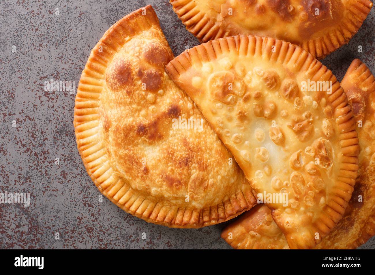Chebureki is a deepfried turnover with a filling of ground or minced meat and onions close up