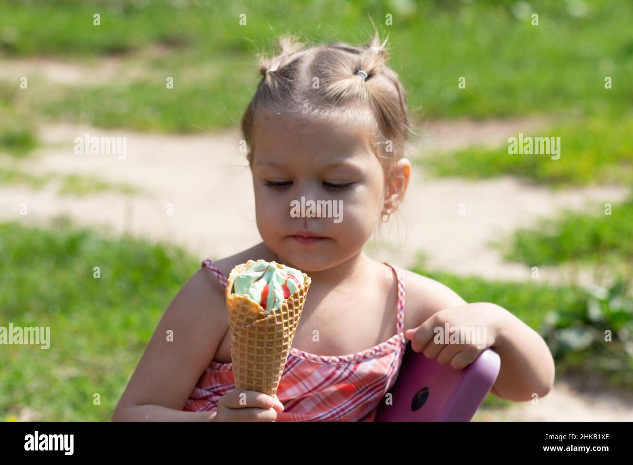 Happy little girl in the summer park Stock Photo - Alamy