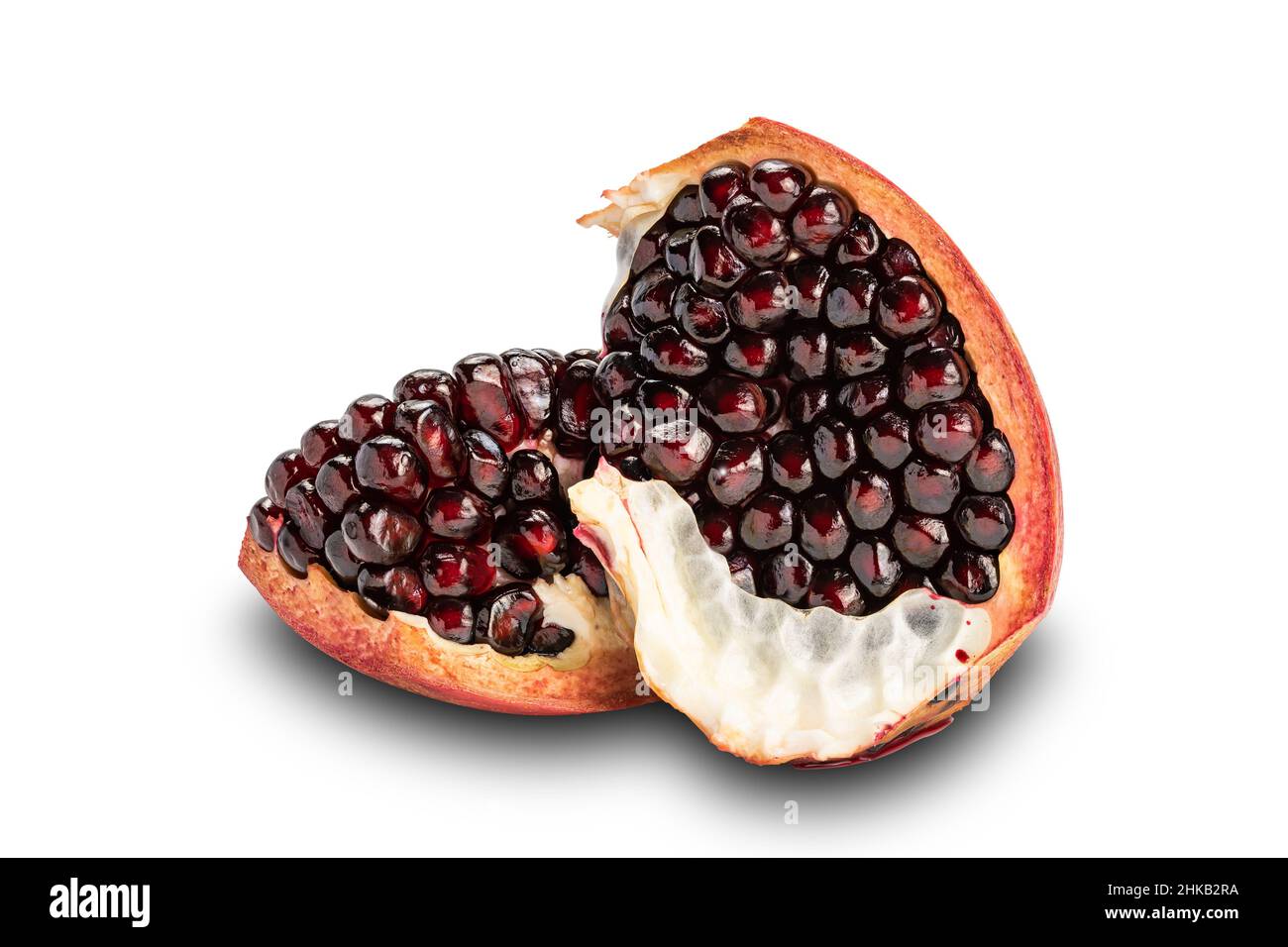 Side view slices of ripe sweet pomegranate isolated on white background with clipping path. Stock Photo