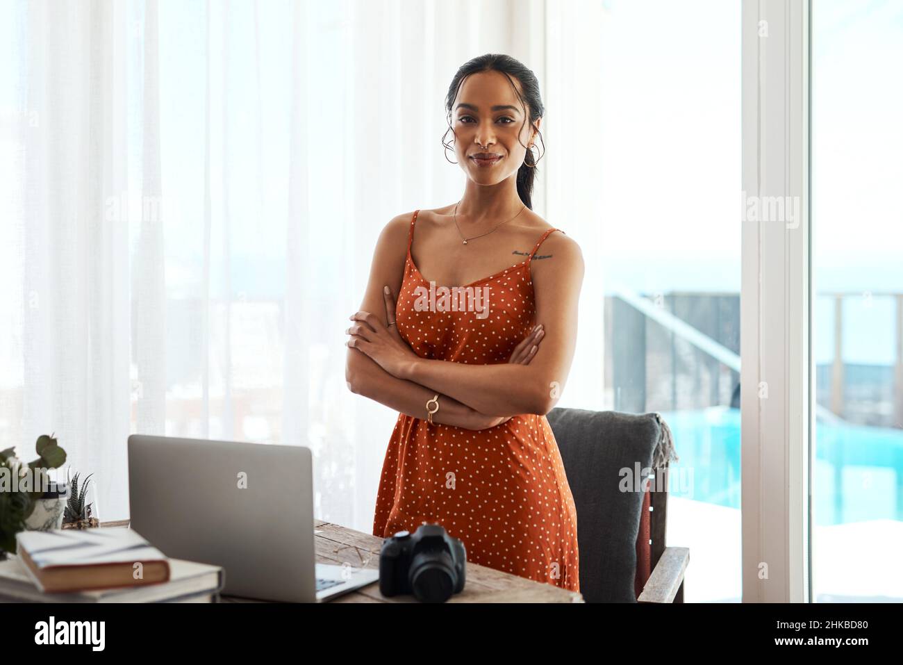 I am destined for success. Cropped portrait of an attractive young businesswoman standing with her arms crossed in her home office. Stock Photo