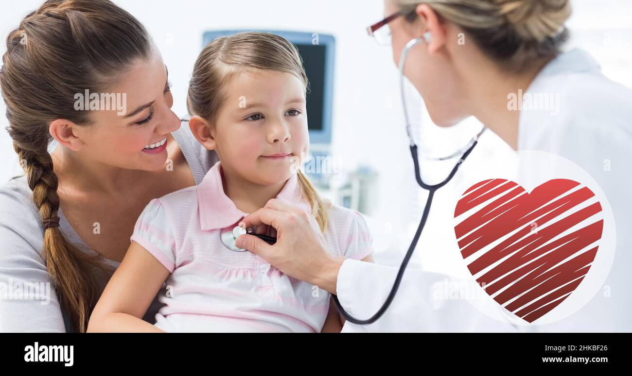 Caucasian mid adult female doctor examining caucasian girl sitting with caucasian young mother Stock Photo