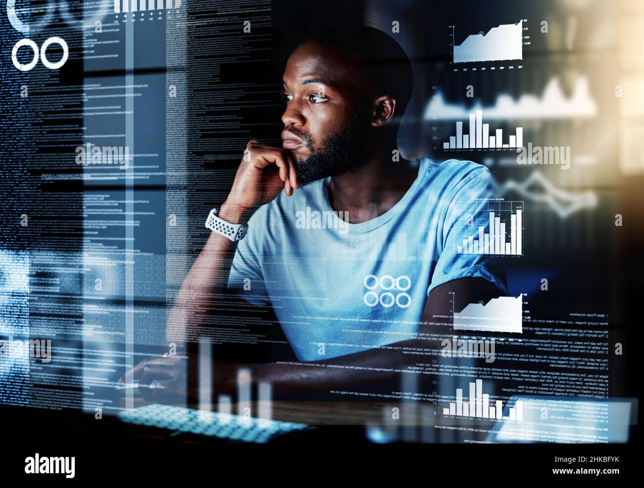 Working in a new dimension. Shot of a programmer working on a computer code at night. Stock Photo