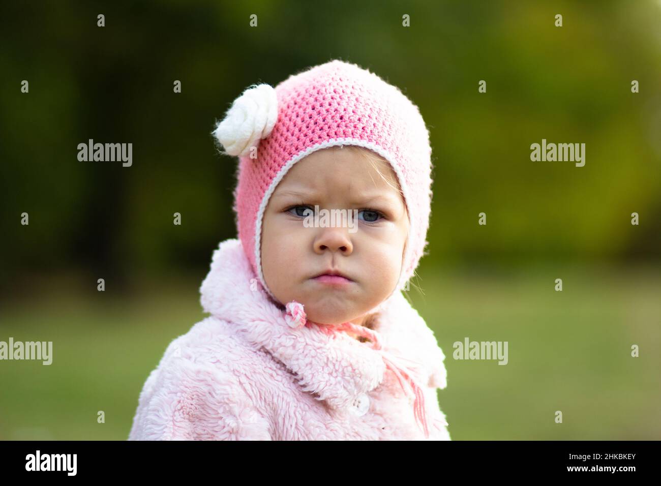 Little girl in the autumn park Stock Photo - Alamy