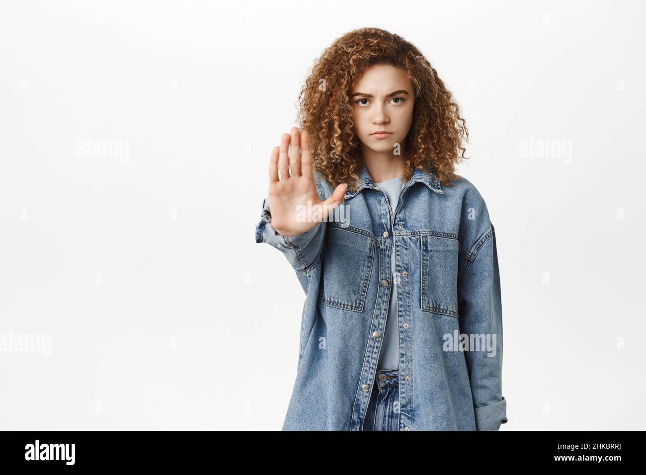 Stop, taboo concept. Young serious woman showing no, prohibit