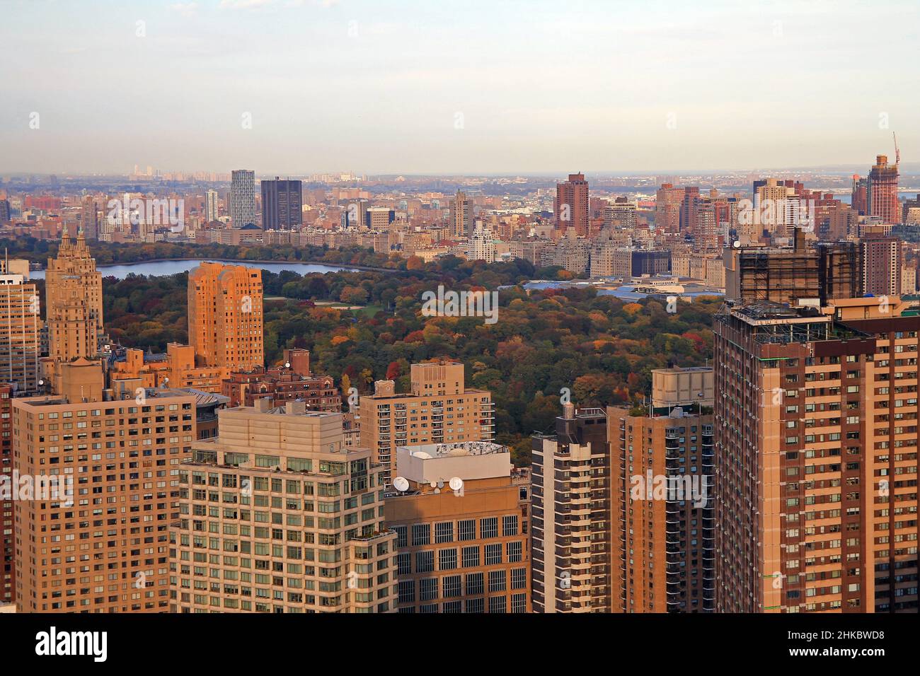 Central Park reservoir and concrete buildings at the sunset Stock Photo