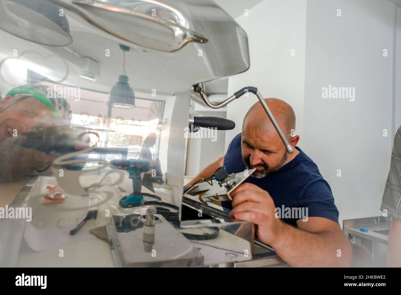 A technician, servicing an espresso coffee machine Stock Photo Alamy