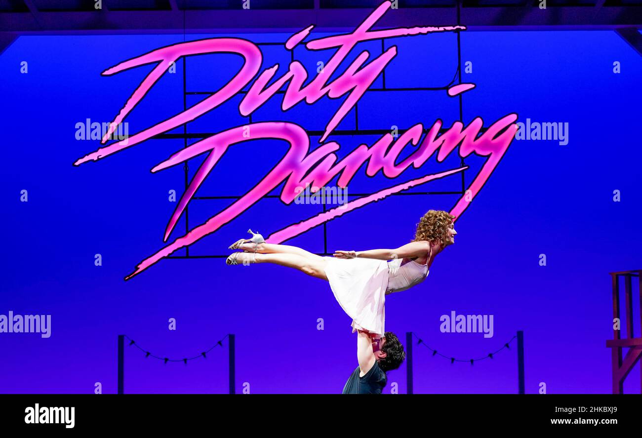 Michael O'Reilly, as Johnny Castle, and Kira Malou, as Frances "Baby" Houseman with the cast of Dirty Dancing - The Classic Story on Stage during a photocall at the Dominion Theatre, London, as the show returns to the West End. Picture date: Thursday February 3, 2022. Stock Photo