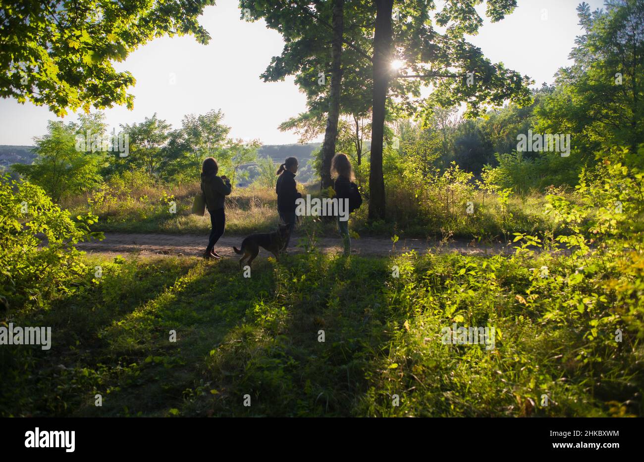 Kharkiv, Ukraine. A family with a dog having a walk in the park Stock Photo