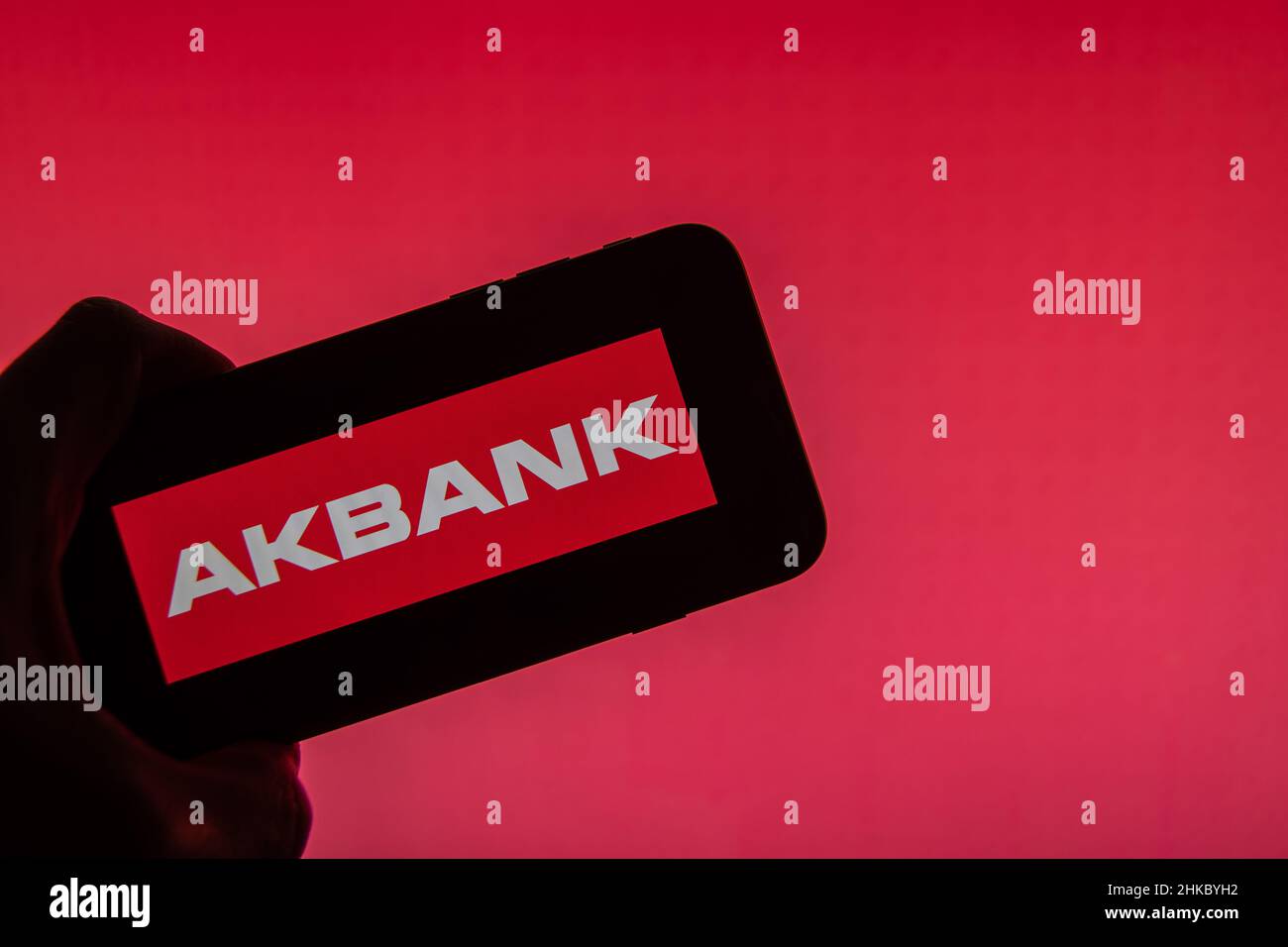 Rheinbach, Germany  2 February 2022,  The brand logo of the Turkish bank "Akbank" on the display of a smartphone (focus on brand logo) Stock Photo