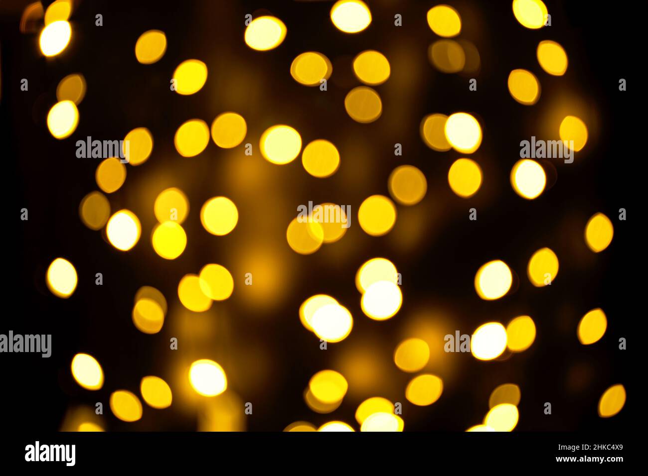 Abstract festive elegant background of blurred with bokeh lights on brown background, defocused Stock Photo