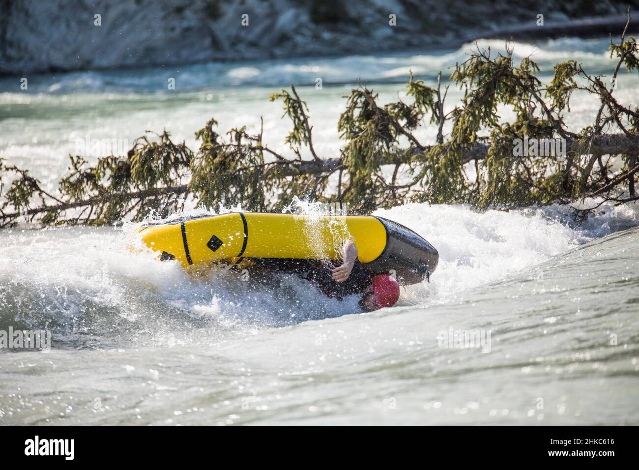 Large rapid flips paddler and raft on river Stock Photo - Alamy