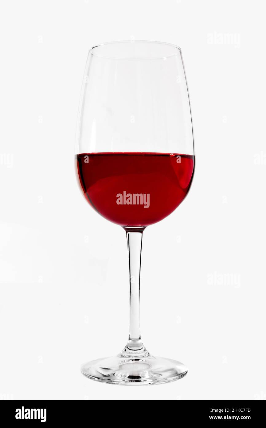 Red Wine in Stemmed Glass over white backdrop Stock Photo Alamy