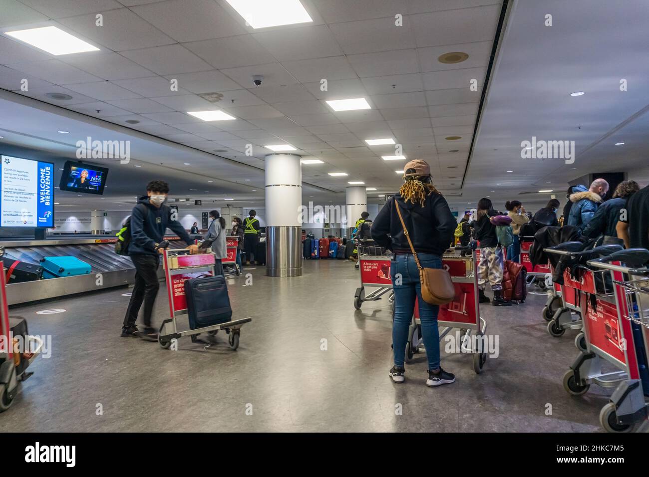 13 Jan 2022, Toronto airport, Canada Masked airline passengers