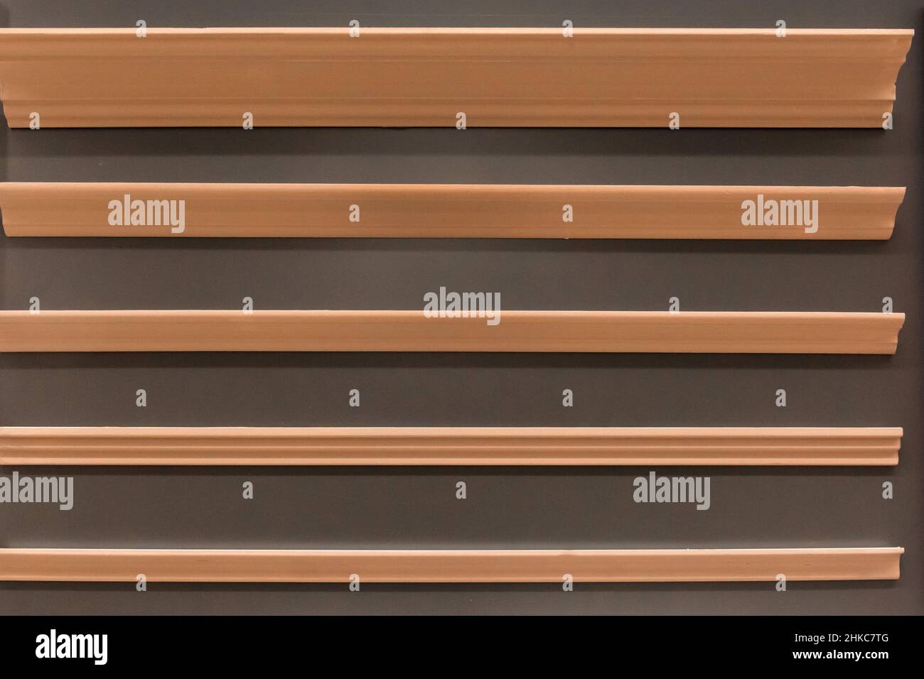 Brown ceiling skirting board material for repair and interior design of