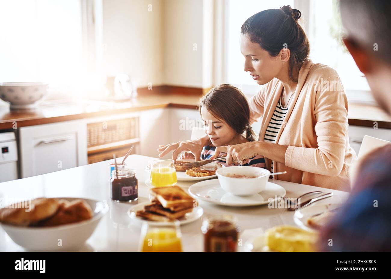 Mom takes good care of me. Cropped shot of a family enjoying breakfast together. Stock Photo