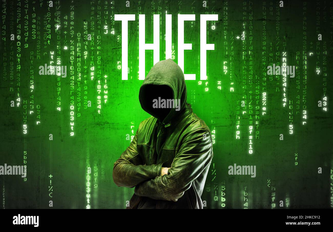 Faceless hacker with inscription Stock Photo