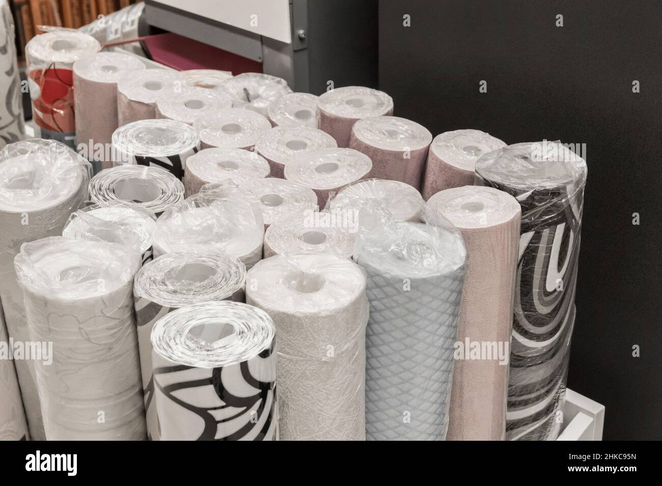 Samples of different wallpaper paper material in rolls for home design and interior decorations of the walls of the room. Stock Photo