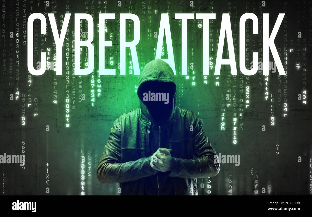 Faceless hacker with inscription Stock Photo
