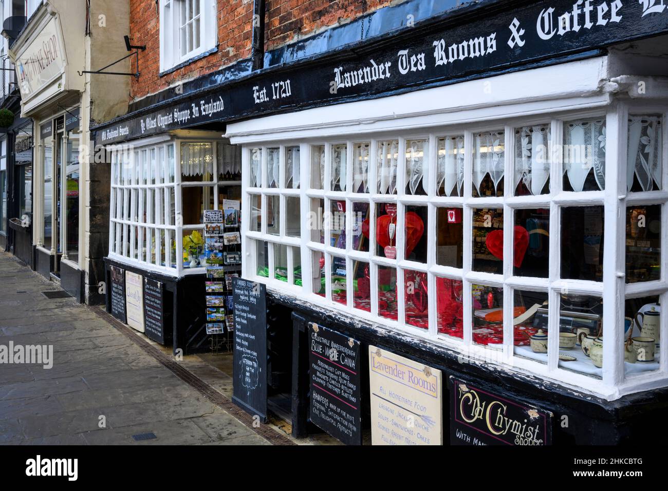 Quaint historic vintage shop & tea rooms business (window display, boards & signs advertising outside) - Knaresborough, North Yorkshire, England, UK. Stock Photo