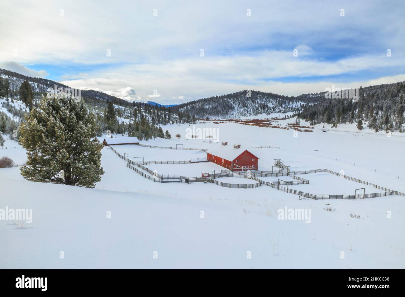 classic old red barn in winter in the dog creek valley near elliston, montana Stock Photo