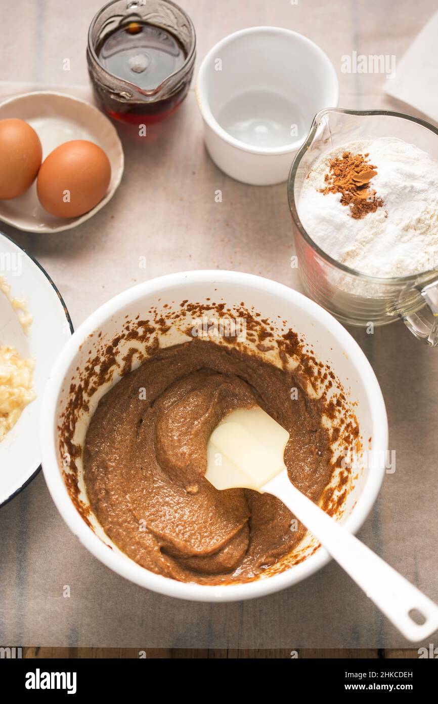 Preparing banana bread batter. With bananas, flour, eggs, maple syrup