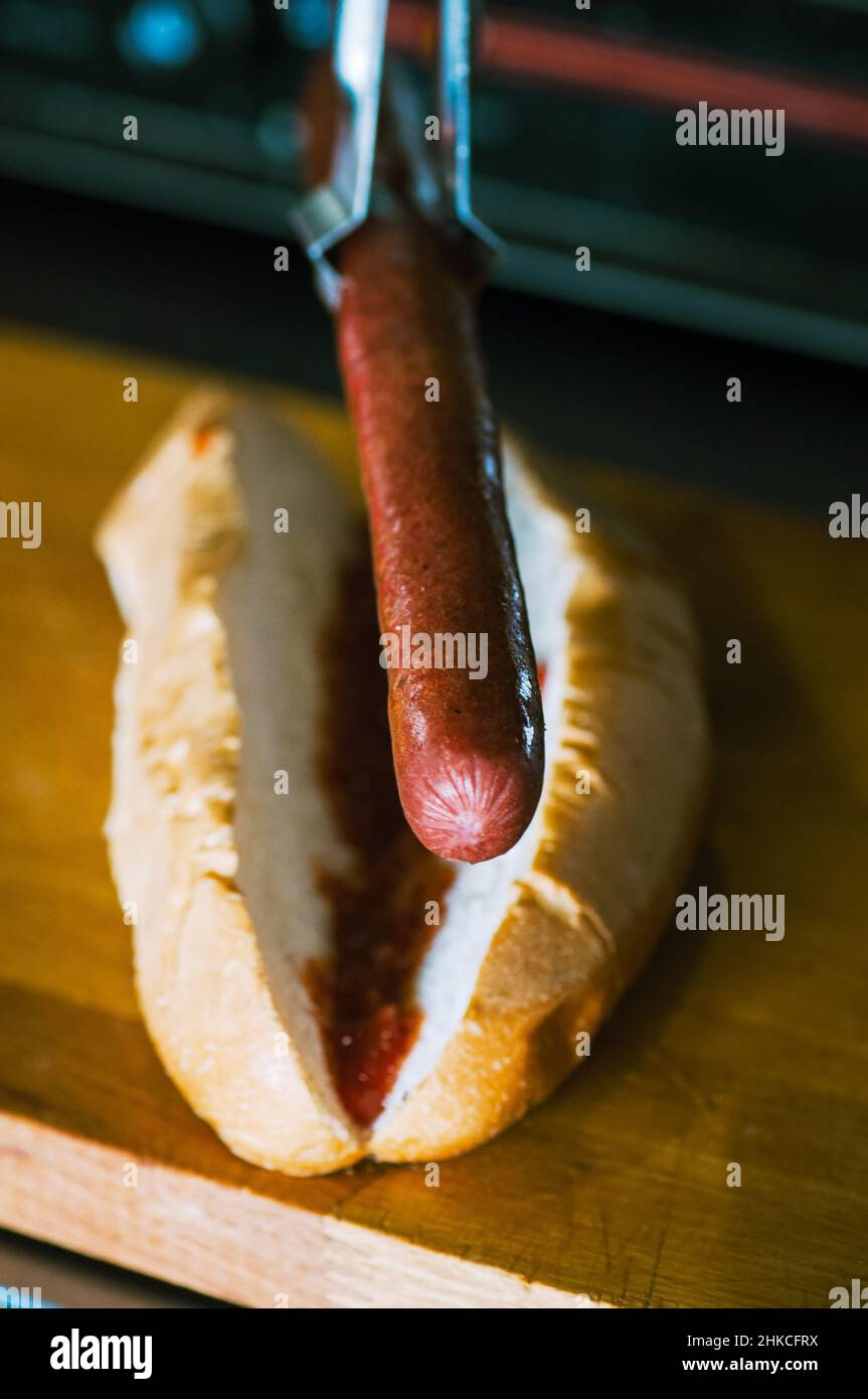 Hotdogs in making. Close up. Stock Photo