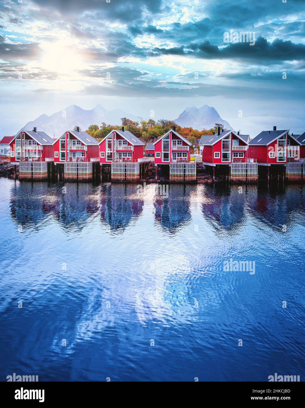 Newer version rorbuer houses are lined up along the coastline of the Lofoten Islands in Svolvaer, Norway. Stock Photo