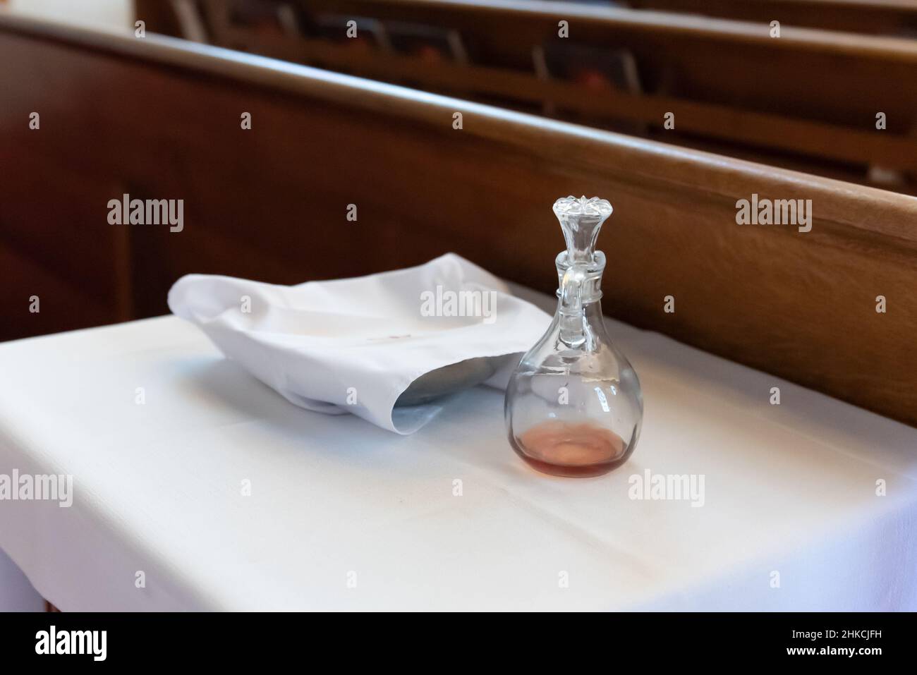 Traditional Catholic church baptism oil flagon and communion bowl are stored after use in the
